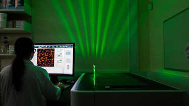 Scientist working in drug screening lab