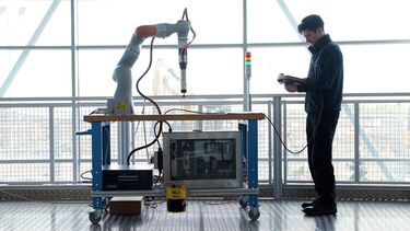 A man working with a collaborative robot at AMRC's Factory 2050