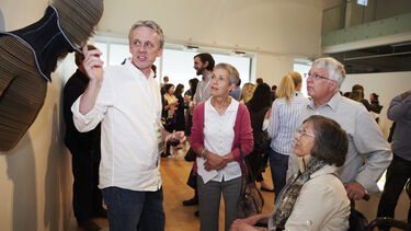 researcher showing head up collar to patients