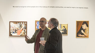 Men having a conversation at the exhibition