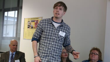 A man speaking to a group
