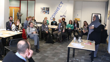 A woman presenting to a group