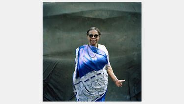 A woman in traditional African dress on the street in Hillfields