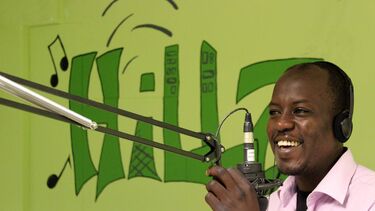 A man speaking into a microphone