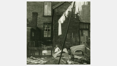 Children play in urban rubble in 1950s Hillfields