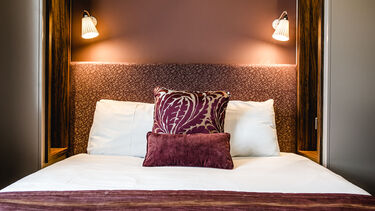A bedroom at Halifax Hall hotel