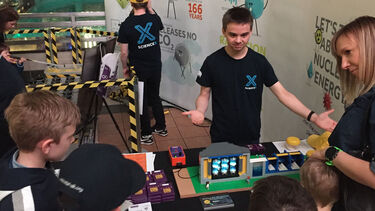 James Mansfield demonstrates how nuclear power works to school students