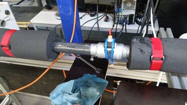 24 mm internal diameter pipe configured with dye injector for tracer studies.