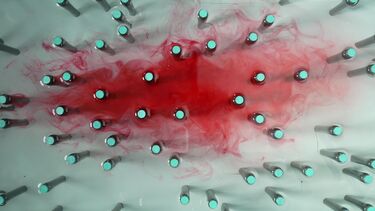 A dye cloud moving through cylinders.