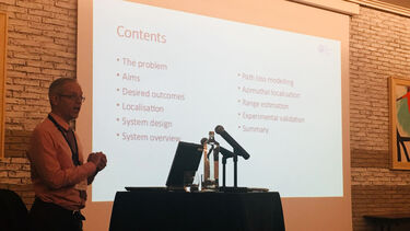 A man giving a presentation at the project workshop year two