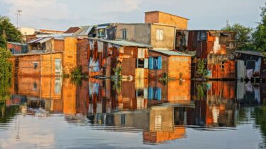 A housing estate reflected in the water