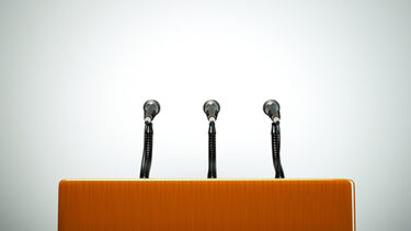 Conference podium with three microphones