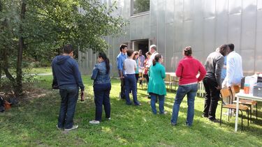 Summer school participants talking outside