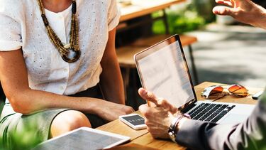 A woman receiving business support.