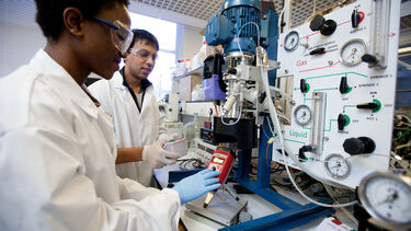 Students looking at air pressure