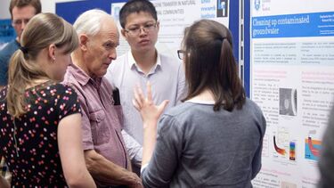 Harry Kroto speaking to people at the science brainwaves event.
