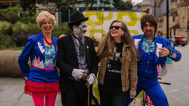Together in the square, Professor Vanessa Toulmin and street performers