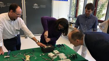 Spinner fellows and supervisors apply spinal fixations to cervical and lumbar spines under the guidance of Aesculap staff and spine surgeons.