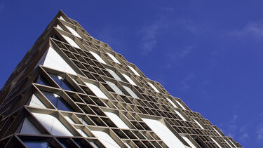 A blue sky above the University's Diamond building