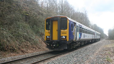 A Northern passenger train running on a single line of track