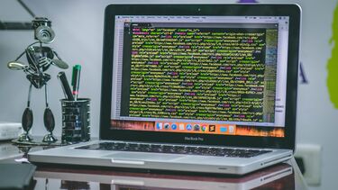 Laptop with programming code on the screen