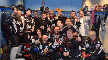 Adam celebrating with his hockey team