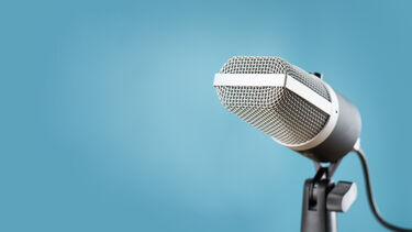 A microphone against a blue background