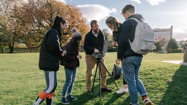 Dr Tom Pering shows students equipment that can be used to monitor volcanoes