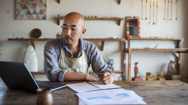 A person managing their accounts for business