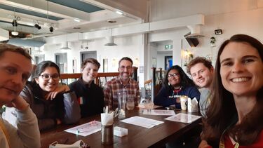 Group of students in a cafe setting for the German Coffee mornings