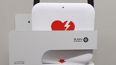 A close-up of the automated external defibrillator in the Mapping Building.