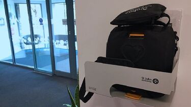 A close-up of the automated external defibrillator in the Management School.