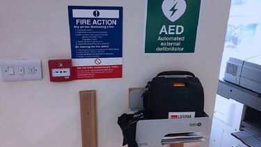 A close-up of the automated external defibrillator in North Campus.