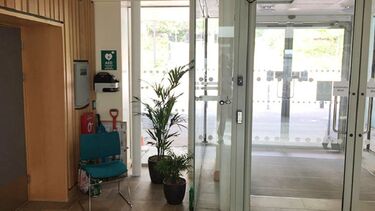 A photo of the SiTRAN lobby showing the location of a defibrillator.