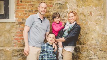 Robbie Edwards with her family, Robbie has leg braces to help with her SPG47