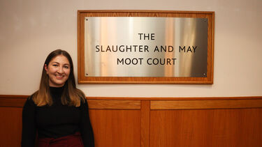 Photograph of School of Law Alumni Jess Edwards standing outside the Moot Court