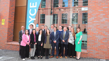 VIP guests in front of Royce Discovery Centre