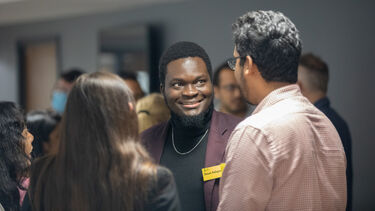 Oluwaseun Adeyemi at a networking event.