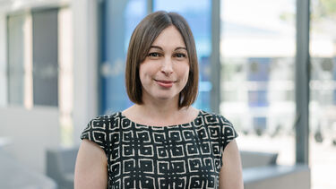 Karen Niven wearing a black and white patterned top.