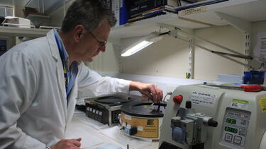 Man working on a machine in a lab