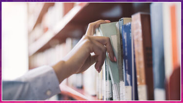 hand taking book from shelf