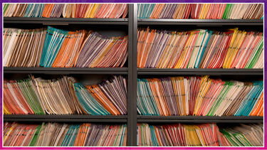 Lots of booklets on a bookshelf