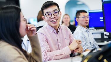 Student in glasses smiling