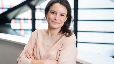 Dr Alice Pyne stood in front of a window in the University's Diamond building