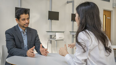 Zaid Jafri sat at a table with another student.
