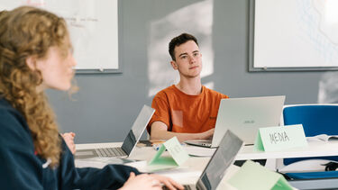 Students in a seminar with laptops