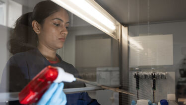 Student using an injector in a lab