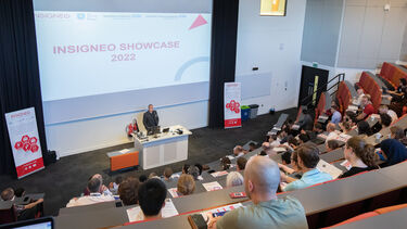 Professor Jim Wild addressing the audience in the auditorium