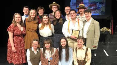 Group of students dressed up for a 1920s theatre play
