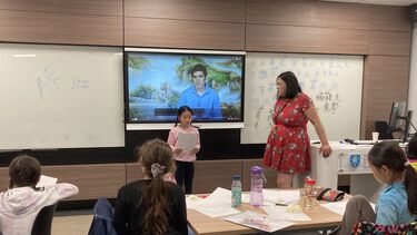 Teacher Qiang with students in Language & Literature class